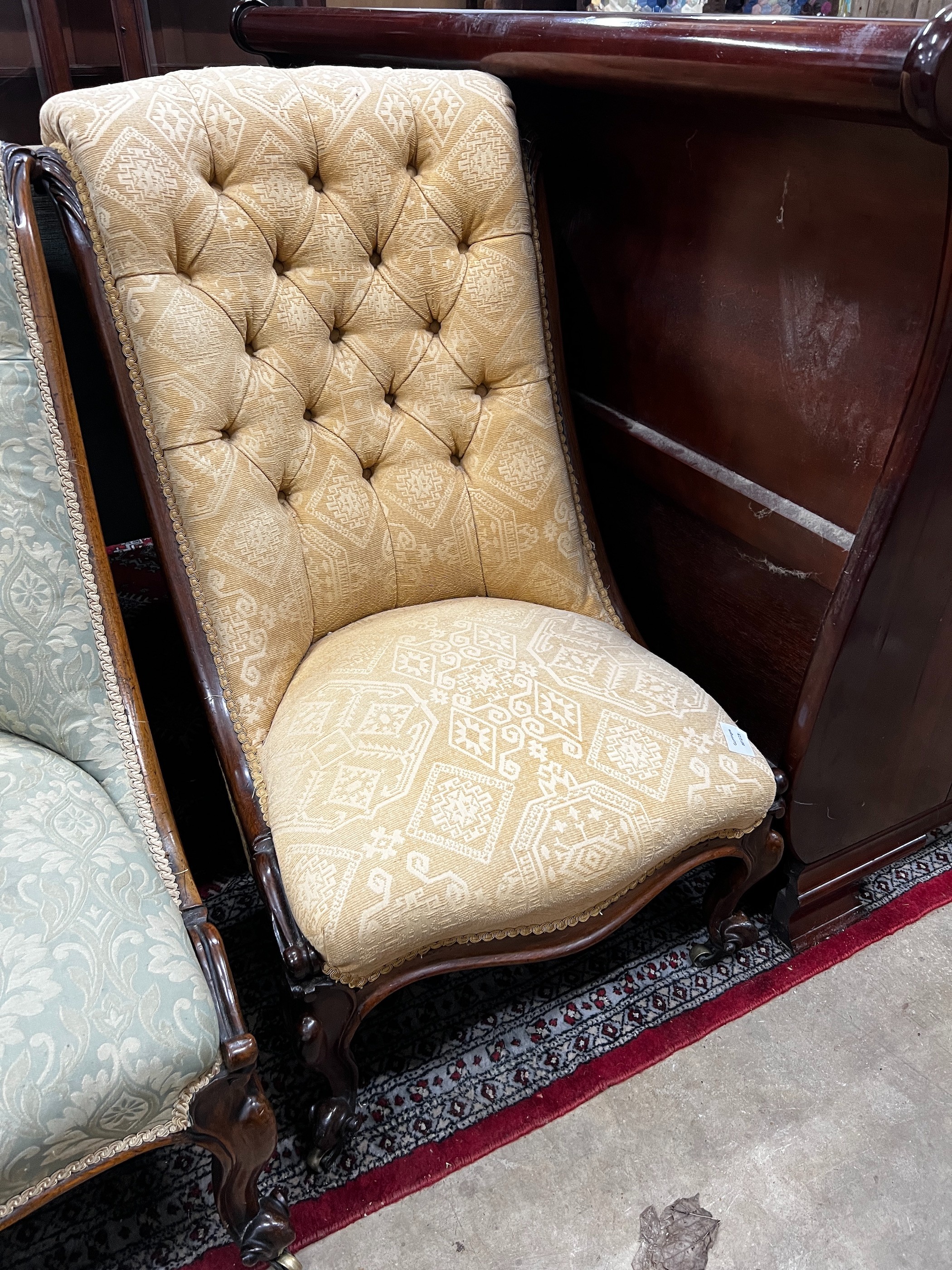 A near pair of Victorian mahogany and rosewood upholstered nursing chairs width 54cm, height 91cm *Please note the sale commences at 9am.